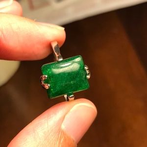 Stunning emerald green rectangle stone ring.